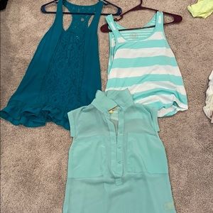 Three super cute blue styled tank tops